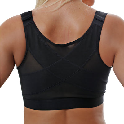 Woman wearing a black post-surgery compression bra, back view
