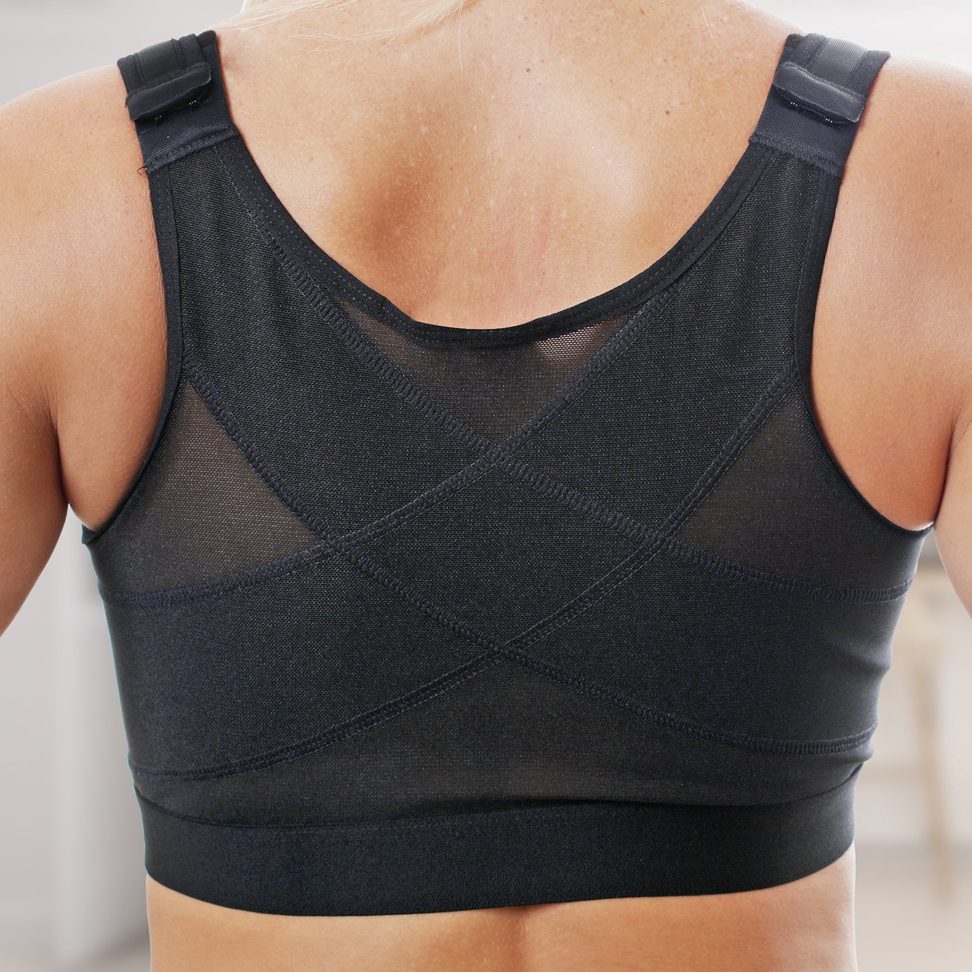 Criss-cross black design on compression surgical bra - back